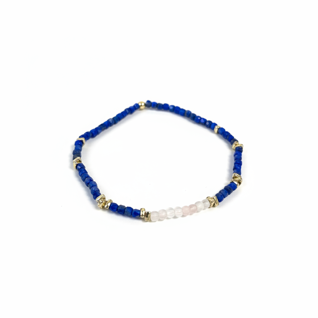 Bracelet with blue beads and gold accents on a white background