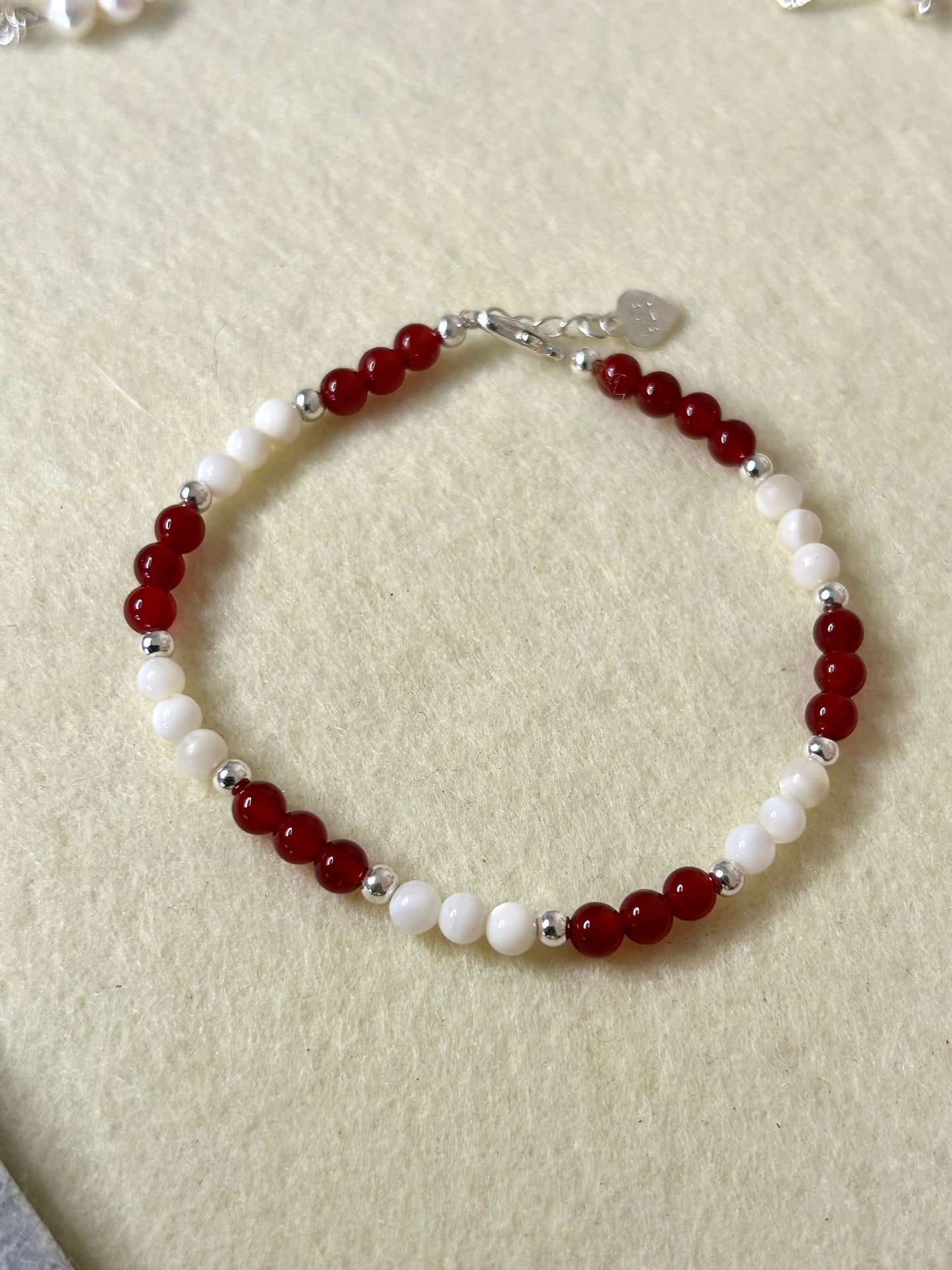 Carnelian, mother of pearl with sterling silver beads and fixings