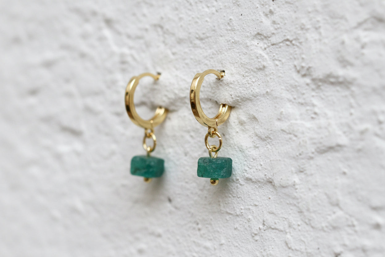 Raw emerald gold coloured huggies.