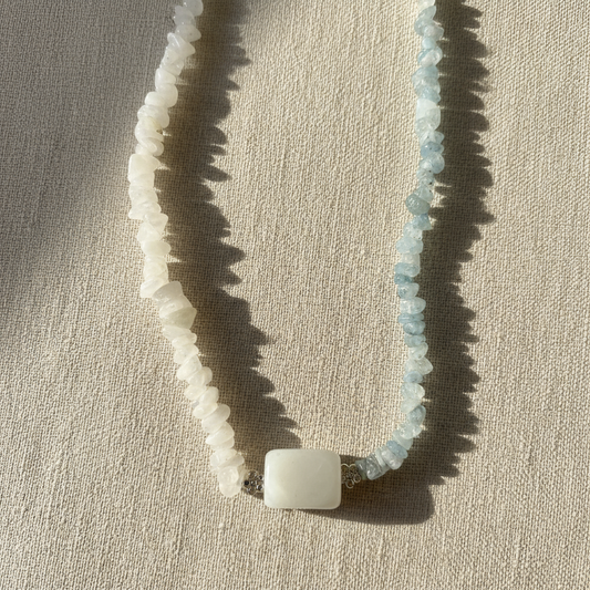 Necklace with natural stone beads and a chunky cubed statement piece.