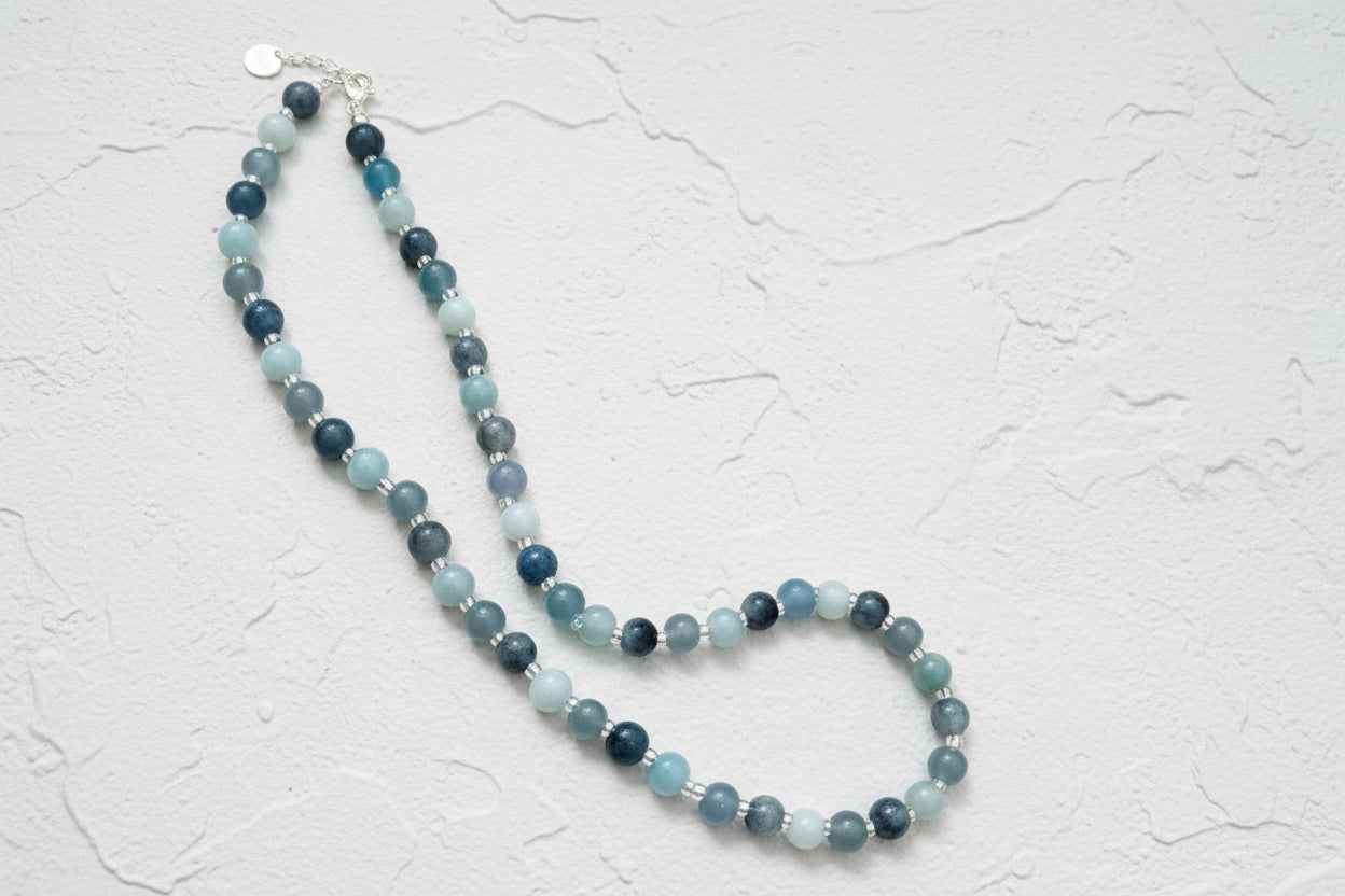 Necklace with blue beads.