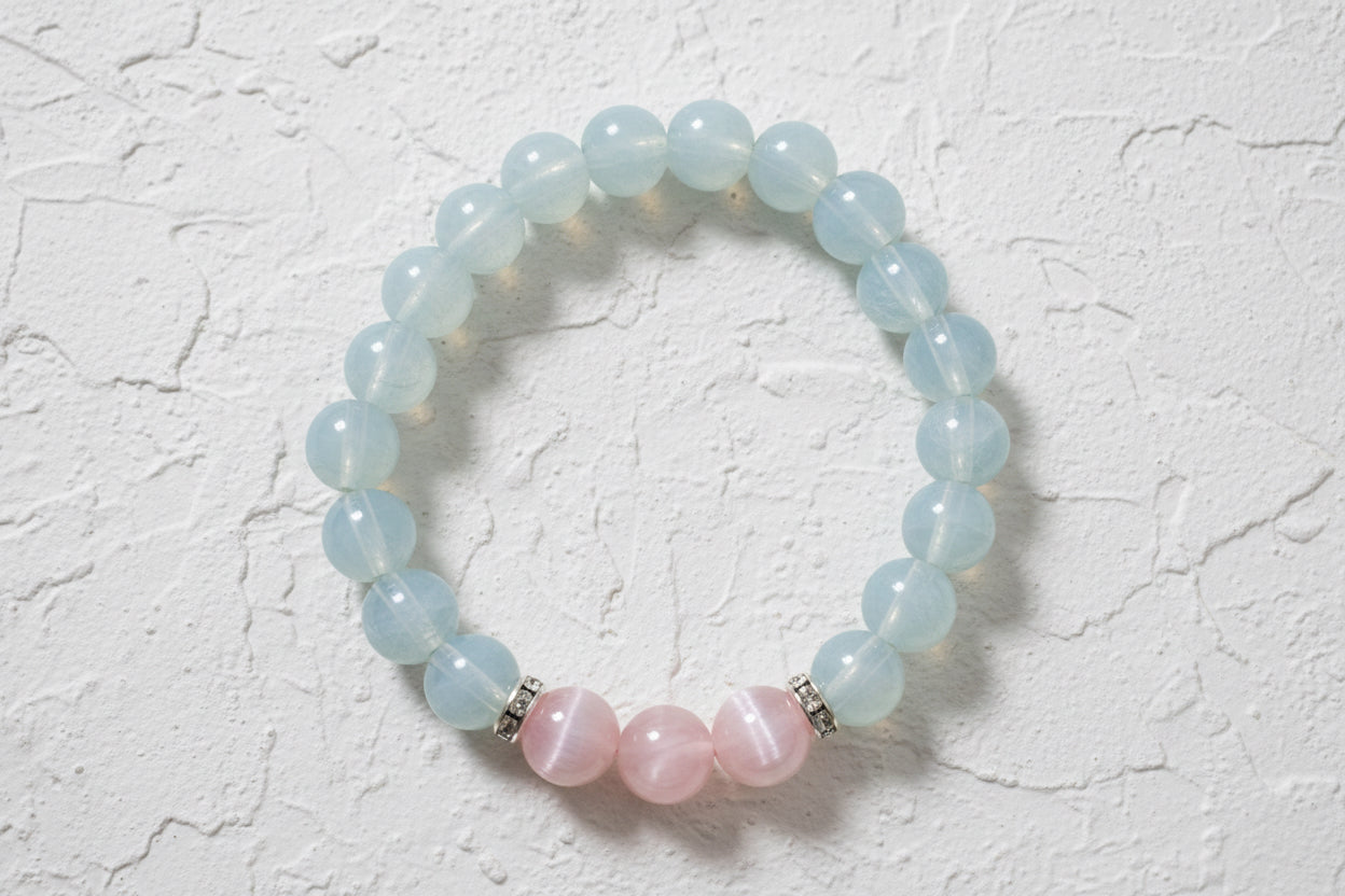 Beaded bracelet with light blue and pink beads.