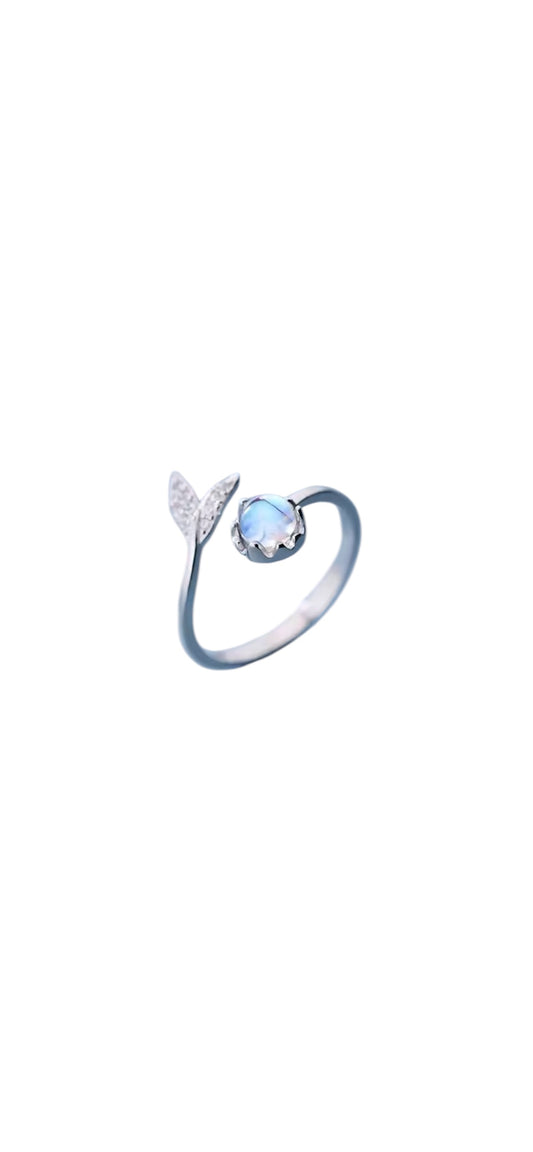 Silver ring with a blue gemstone and a mermaid tail.