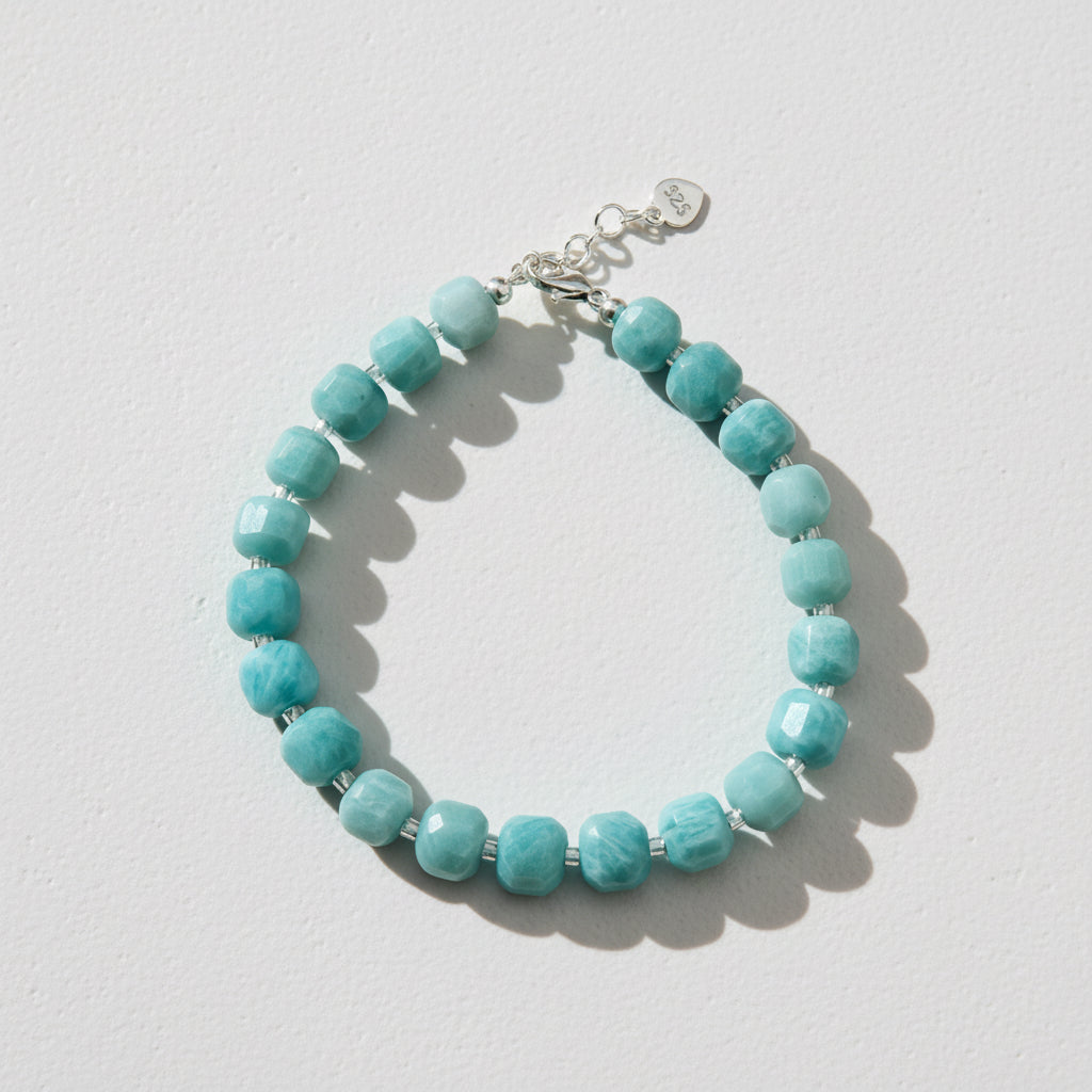 Turquoise coloured beaded bracelet with a silver lobster clasp.