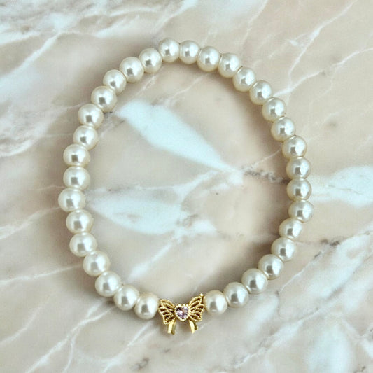 White faux pearl bow bracelet