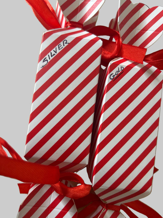 Red and white striped cracker with a ribbon.