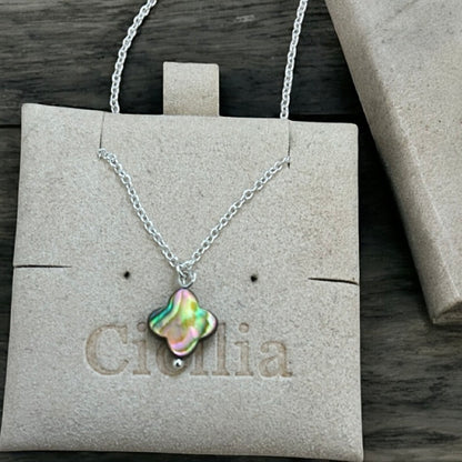Necklace with a colourful abalone clover shaped pendant on a silver chain.
