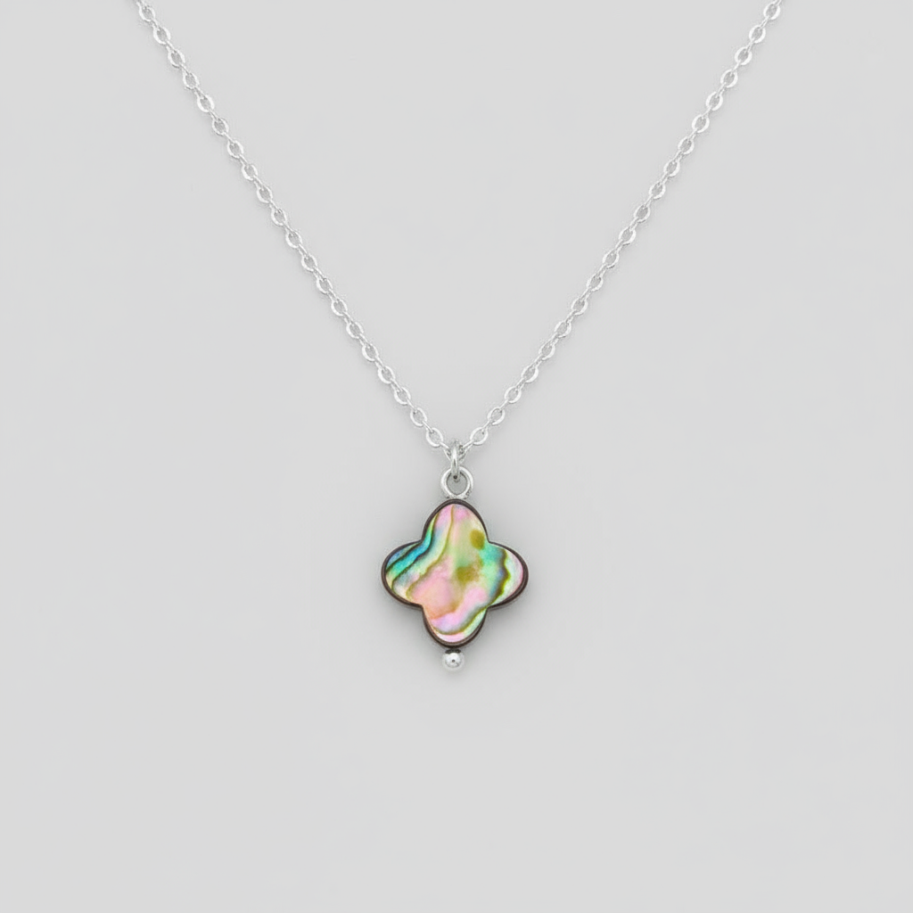 Abalone shell clover shaped pendant with a sterling silver chain.