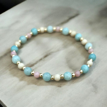 A multicoloured beaded bracelet with blue, cream, and pink opal stones.
