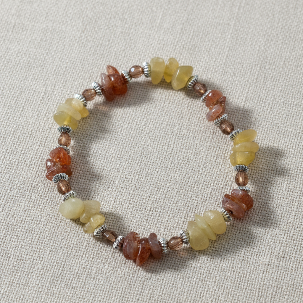 Honey calcite & sunstone crystal chip bracelet on linen background