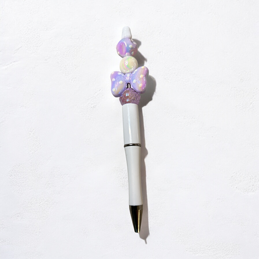 White and purple bow spotty pen