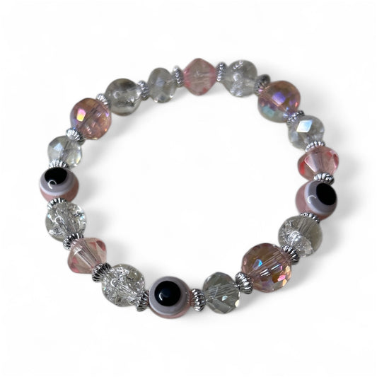 Multicoloured beaded bracelet on a white background.