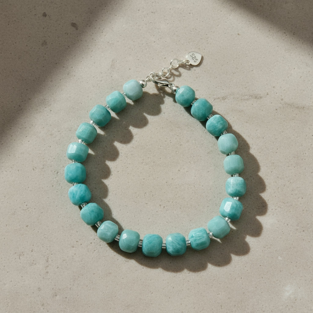 Turquoise coloured beaded bracelet with a silver lobster clasp.