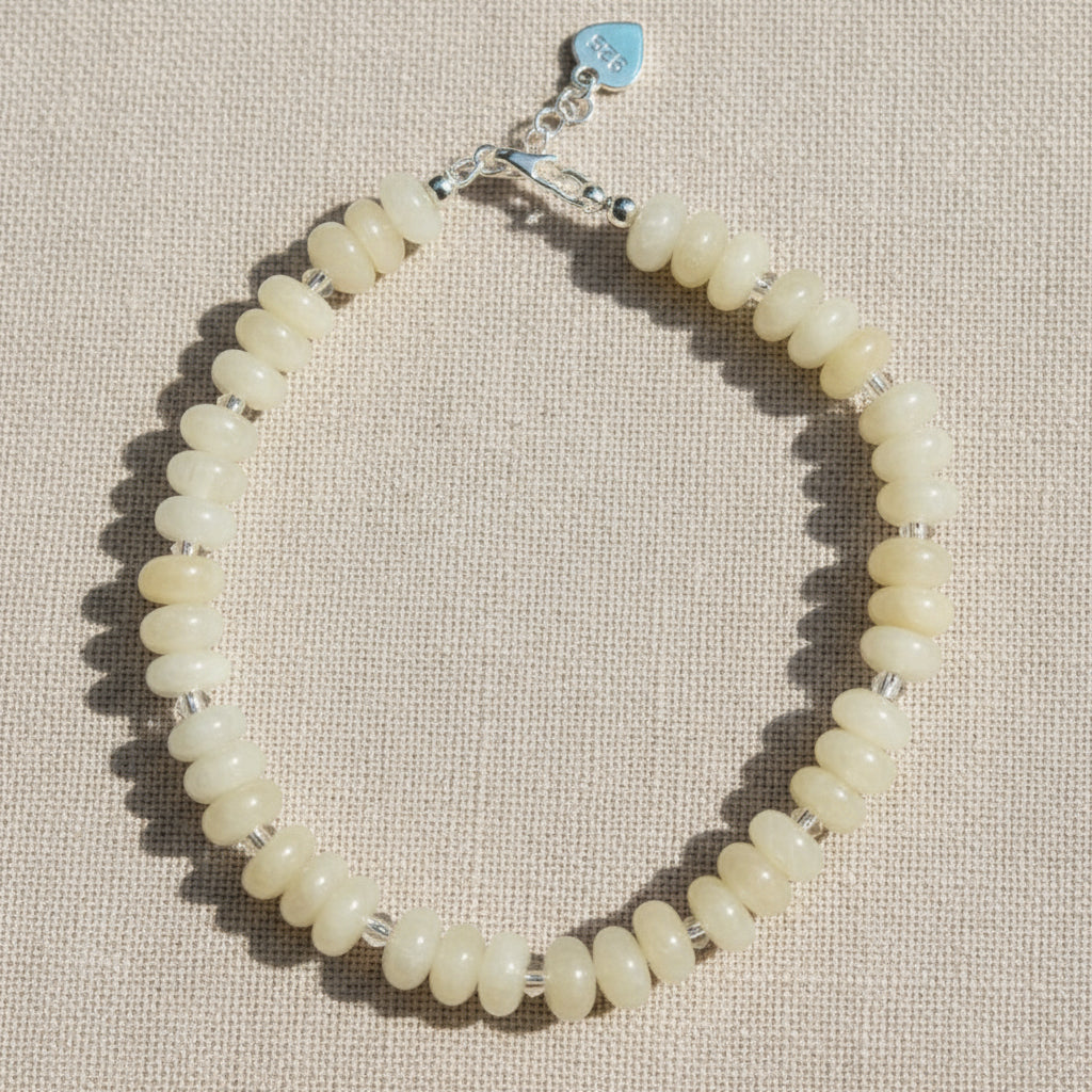 Bracelet with light yellow gemstone beads.