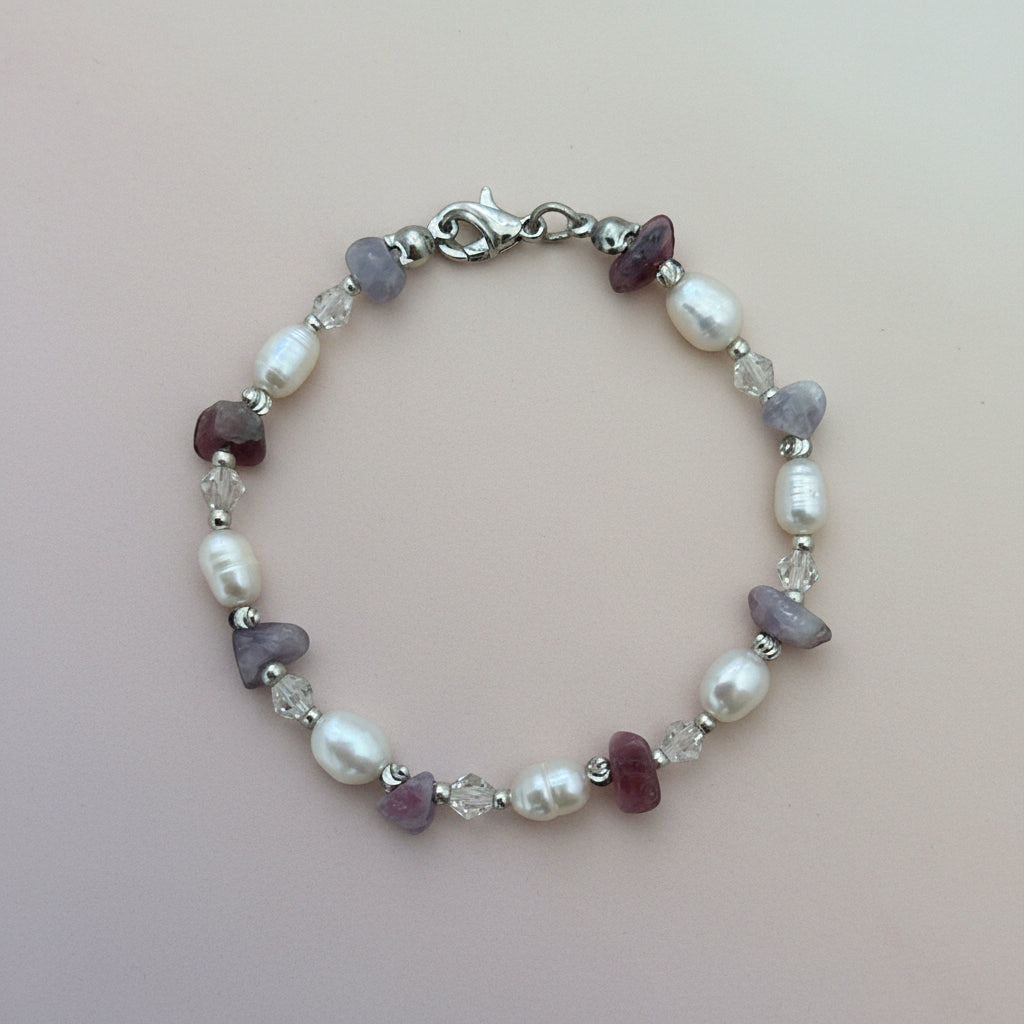 Fresh water pearls and unicorn jasper chip crystal beads in lilac and purple.