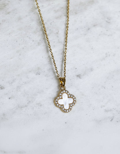 Mother of pearl pendant necklace on a gold coloured chain.